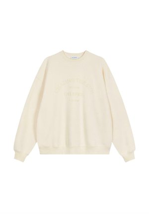 Cremefarbenes Sweatshirt mit rundem Halsausschnitt, langen Ärmeln und gerippten Bündchen. Auf der Vorderseite ist der erhabene Text "CHASING THE SUN" zu sehen.