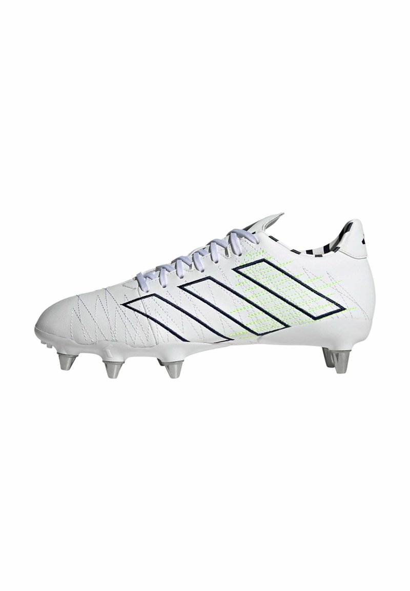 Botines de fútbol blancos con acentos multicolores, presentan una parte superior texturizada, cinco tachuelas metálicas y un diseño con cordones. Detalles en negro y verde neón.