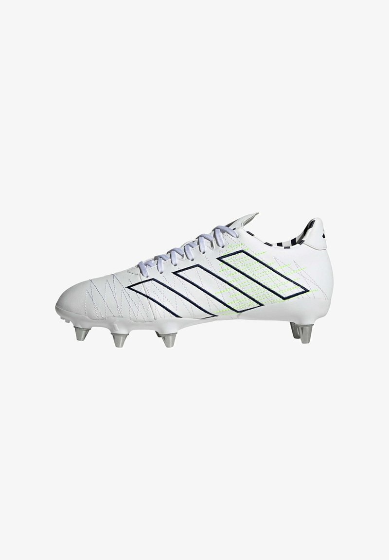 Botines de fútbol blancos con acentos multicolores, presentan una parte superior texturizada, cinco tachuelas metálicas y un diseño con cordones. Detalles en negro y verde neón.