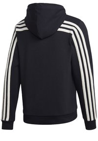 Sweat à capuche noir avec trois bandes blanches courant le long de chaque manche de l'épaule au poignet.