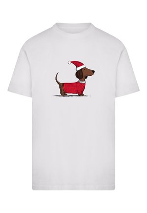 T-shirt blanc avec un dessin humoristique d'un teckel portant un pull rouge et un bonnet de Père Noël, illustré en brun et rouge avec des contours noirs simples.
