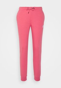 Růžové tepláky vyrobené z měkké bavlny s elastickým pasem, nastavitelným šňůrkou a žebrovanými manžetami. Na levé straně mají malé logo.