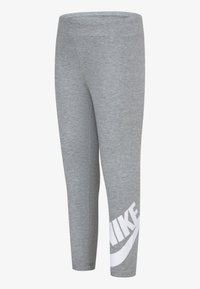 Leggings atléticos cinzentos feitos de um tecido suave, com um logo branco da Nike na parte inferior da perna esquerda e uma cintura elástica alta.