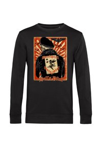 Černá mikina se snímkem lebky v baretu a bomberové bundě, s ilustrací ve vintage stylu a červenými akcenty.
