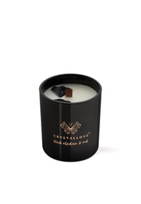 Portacandela in vetro nero con un pezzo di ossidiana nera, stoppino in legno e scritta dorata "CRYSTALLOVE ossidiana nera & oud".