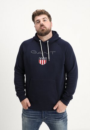 PLUS SHIELD HOODIE - Jersey con capucha - evening blue
