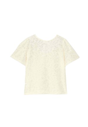 Haut à manches courtes en tissu crème doux, avec un motif floral subtil. Col rond, coupe décontractée et texture lisse.