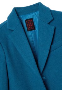 Teal wollen blazer van een wolmix met een uitgesneden kraag, enkele knoopsluiting en een gladde blauwe voering. Merkenlabel zichtbaar aan de binnenkant.