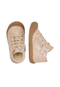 Scarpe per bambini di colore rosa chiaro con spruzzi dorati, suole in gomma marrone, lacci e cerniere laterali con cinturini in Velcro.