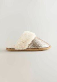 Glittery gold slipper with a soft, cream faux fur band and lining, featuring a flat, textured sole for indoor wear. Simple, rounded design.