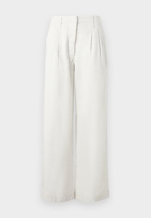 Φαρδιά μπεζ παντελόνια από υφή υφάσματος, με πιέτες μπροστά και σχεδιασμό με ψηλή μέση. Λείο ύφασμα με ελάχιστες λεπτομέρειες.
