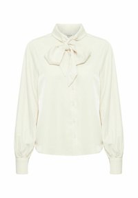 Blusa cream con fiocco al colletto, maniche lunghe, chiusura con bottoni sul davanti e una texture di tessuto liscia.