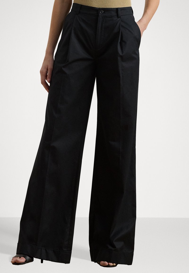 Black wide-leg trousers made of smooth fabric, featuring front pleats, a button closure, and a clean hemline.