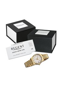 Montre-bracelet dorée avec un cadran argenté texturé, fenêtre de date et un bracelet maillon. Inclus deux boîtes noires et un certificat de garantie.