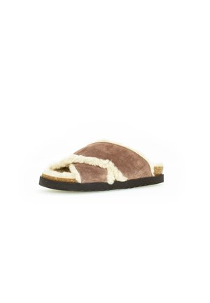 Brown suede slipper with shearling lining, open toe, and cross-over design. Textured outsole with a contrasting black edge.