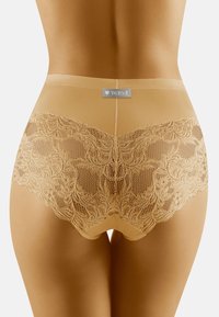 Nude underkläder med spetskant och blommönster i transparent material, med en mjuk övre kant och en etikett som visar 'Wolbar' varumärkeslogotyp.