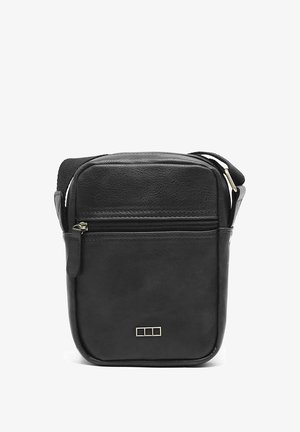 Must mustrakk nahkrist kott, millel on lukustatav eestasku, ristkülikukujuline kuju ja peened kuldsed detailsed aksessuaarid. Sujuv tekstuur ja minimaalne disain.