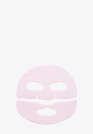 Masque visage en feuille rose pâle en deux parties avec découpes pour les yeux, le nez et la bouche sur un fond clair uni.