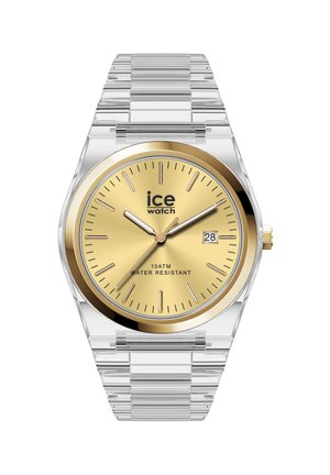 Läpinäkyvällä hihnalla varustettu rannekello, jossa kultainen pyöreä kellotaulu, kultaiset tuntimerkinnät ja viisarit, päivämäärän näyttö, merkinnät "ice watch" ja "10ATM vesitiivis."