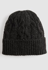 Cable-knit black wool beanie with a ribbed cuff, showcasing a textured surface and a rounded top. Suitable for cold weather.