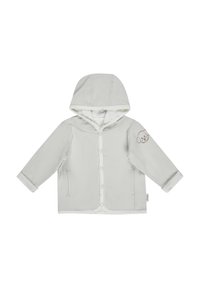Light gray hooded jacket with a button front, side pockets, rolled cuffs, and a small brown dog outline on the left sleeve. Soft fabric texture.