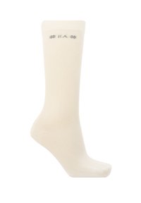 Calza beige alta fino al ginocchio realizzata in tessuto morbido. Presenta un delicato motivo testurizzato e il logo nella zona della caviglia.