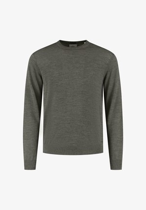 Mørkegrøn langærmet sweater lavet af blødt, struktureret stof. Har en rund halsudskæring og ribstrikkede manchetter med en lige kant og minimal detaljer.