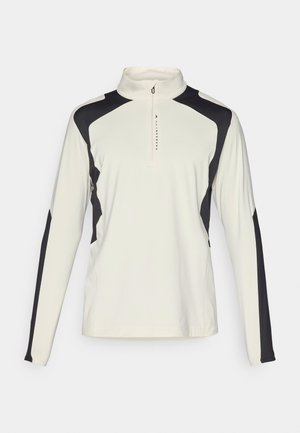 Pitkähihaine pullover vaaleassa kermassa mustilla yksityiskohdilla. Ominaisuuksiin kuuluu korkea kaulus ja neljännesvetoketju. Sujuva tekstuuri ja tiukka malli.