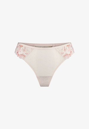 Lace-trimmed string in zacht beige met stippenstructuur en bloemenpatroon aan de zijkanten. Elastische tailleband voor comfortabel dragen.