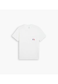 White cotton T-shirt with short sleeves, round neckline, and a chest pocket featuring red and blue embroidery of "Paris." Plain texture.