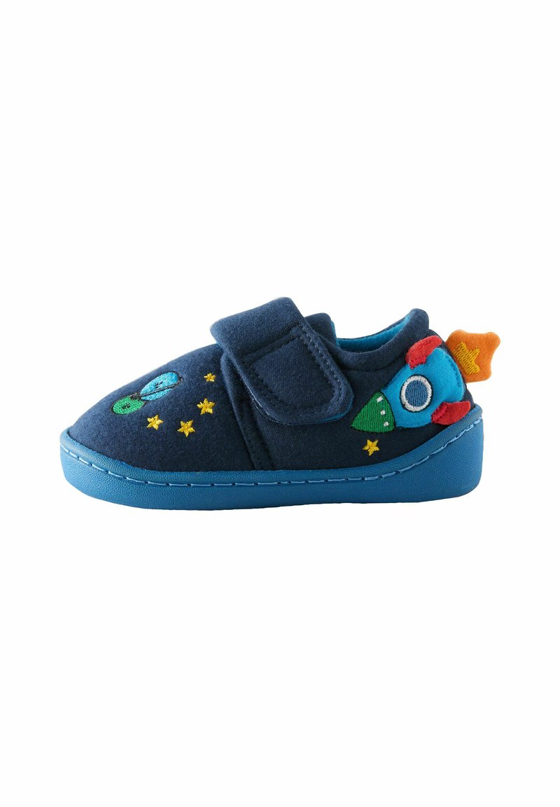 Navy blue fabric slipper with a Velcro strap, rocket and green alien embroidery, yellow stars, and a textured blue sole.