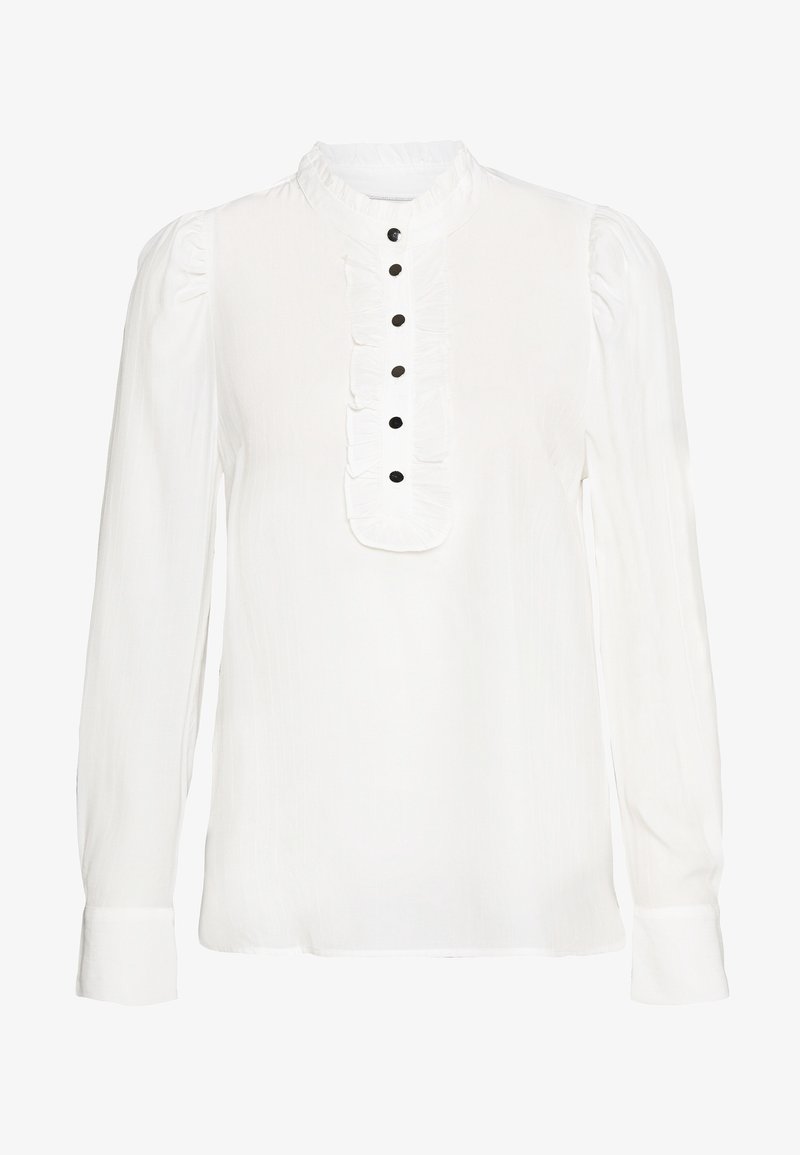 Blusa bianca a maniche lunghe in tessuto leggero con colletto alto, piastra arricciata e cinque bottoni neri sulla parte anteriore. Polsini piatti sulle maniche.