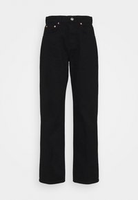 Pantalones de mezclilla de algodón negros con corte recto, diseño de cinco bolsillos y herrajes en tono cobre en la cinturilla y los bolsillos frontales.