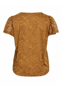 Nėriniuotas viršus geltonos garstyčių spalvos su trumpomis plazdančiomis rankovėmis, turintis gėlių raštą ir laisvą siluetą. Nugaros iškirptė yra apvali.