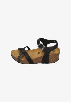 Black wedge sandal with adjustable ankle strap, cork footbed, and woven front straps. Rubber outsole for grip and durability.