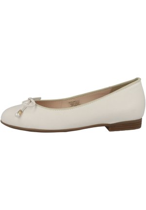 Beige faux leather ballet flat with a round toe, decorative bow, and pearl accent. Features a low heel and contrasting brown sole.