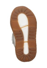 Rubberen schoenzool met een getextureerd, bruin profiel. Witte accenten en groeven verbeteren de grip. Vlak ontwerp voor stabiliteit.