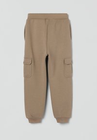 Beige sweatpants med ribbet talje og manchetter, der har to sidelommer og to cargo-lommer på lårene med knaplukninger.