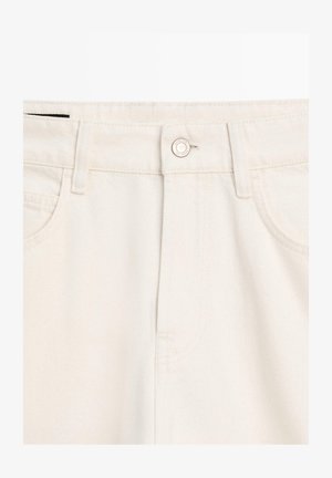 Beige denim jeans featuring a button closure, front pockets, and a smooth texture. The fabric appears sturdy with a classic five-pocket design.