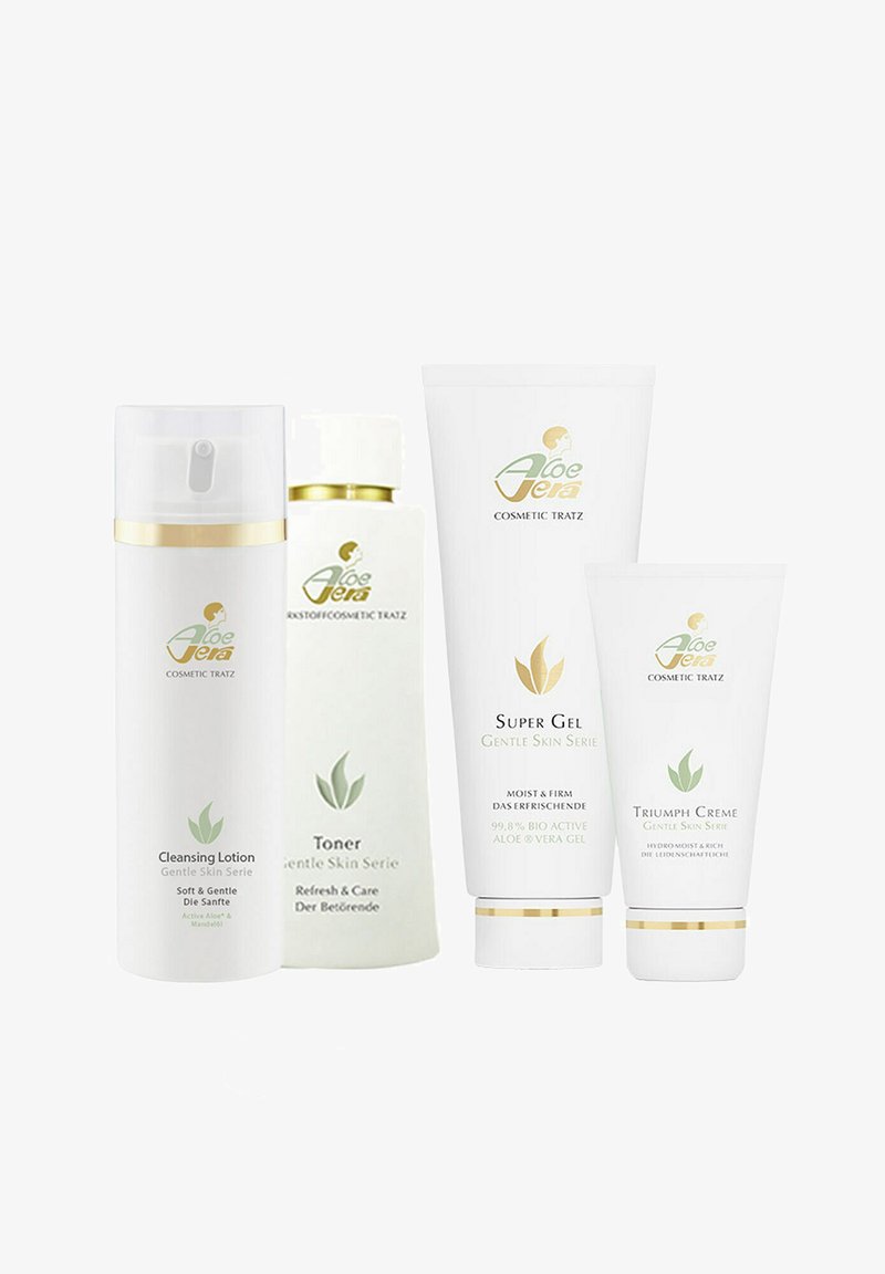 Set of four skincare products in white packaging, featuring gold accents. Includes cleansing lotion, toner, super gel, and triumph cream.
