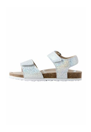 Glitrende hvide sandaler med to justerbare remme, kork-såle og tekstureret gummiydersål for godt greb. Glat overflade med glitrende detaljer.