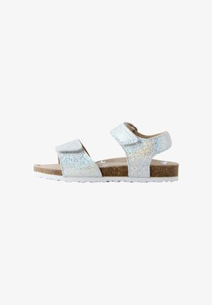 Glitrende hvide sandaler med to justerbare remme, kork-såle og tekstureret gummiydersål for godt greb. Glat overflade med glitrende detaljer.