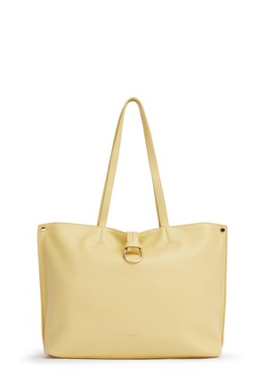 Borsa tote giallo chiaro con manici lunghi e dettaglio centrale ad anello dorato sulla parte frontale.
