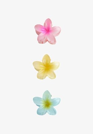 Colorful plastic flower-shaped hair clips in pink, yellow, and blue, each with a glossy finish and four petals, featuring a central accent.