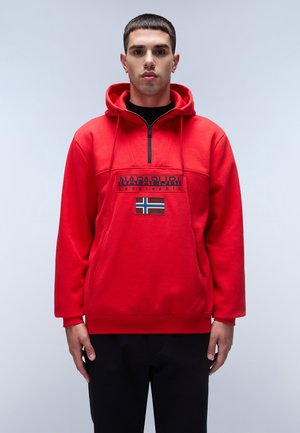 Red pullover hoodie in soft fabric, featuring a half-zip design, front logo patch, and Norway flag accent. Casual fit with ribbed cuffs.