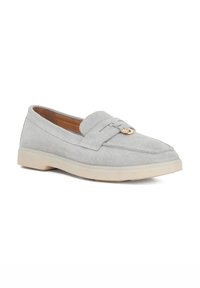 Light grey suede loafer with a padded collar, subtle stitching details, and a gold-tone emblem on the vamp. Cream-colored rubber sole.
