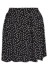 Jupe noire à pois blancs, avec un design plissé et une taille élastique. Le tissu semble lisse avec une texture légère.