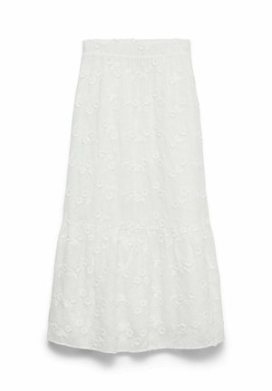 Jupe midi blanche avec taille élastique et délicat motif floral brodé, présentant un volant plissé près de l'ourlet.