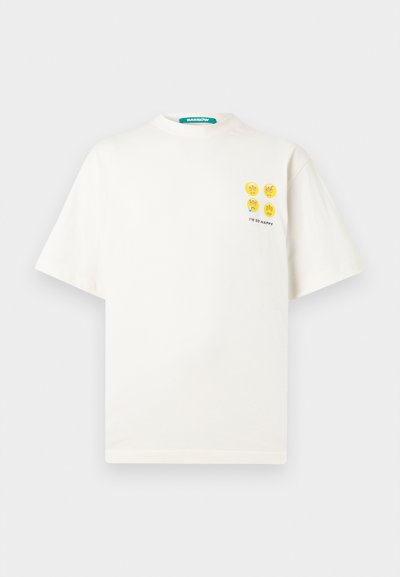 White cotton t-shirt with a relaxed fit, featuring four yellow smiley faces and the text "I'M SO HAPPY" on the left chest area.