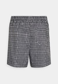 Černobílé kostkované šortky s elastickým pasem, s zadní kapsou a volným střihem. Vyrobené z lehké tkaniny.
